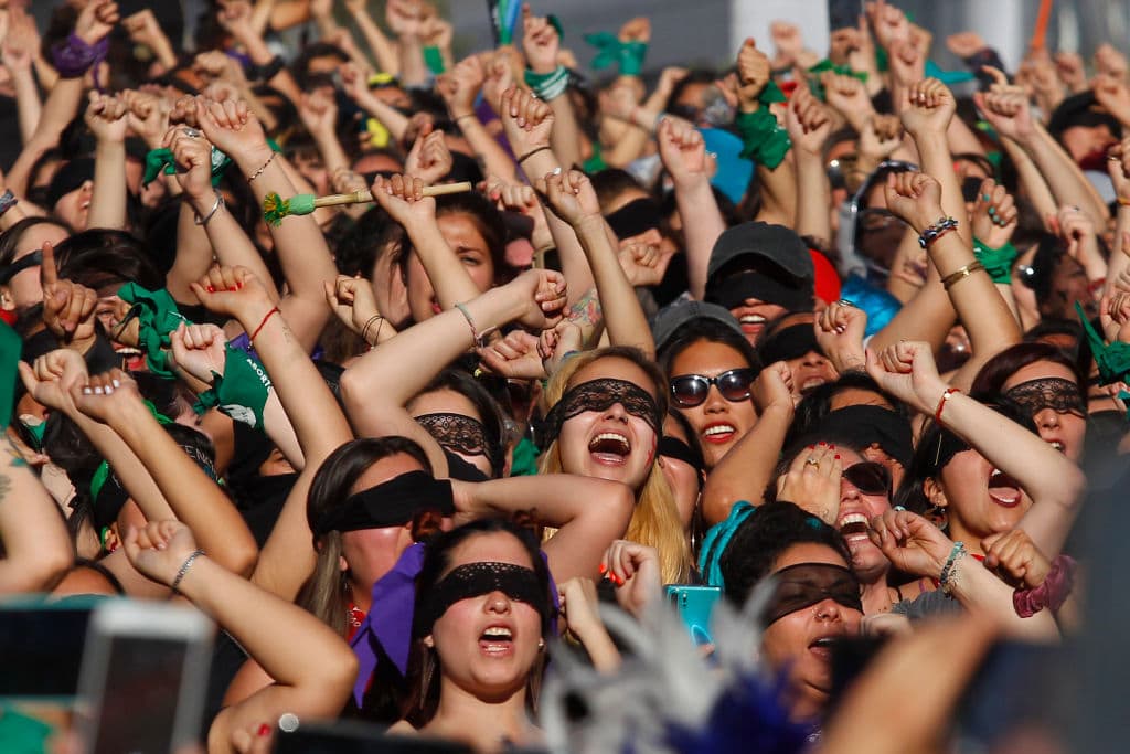 Women sing and perform during the demonstration and performance 'Un violador en tu camino' organized by feminist group Lastesis in Santiago, Chile. (Marcelo Hernandez/Getty Images)