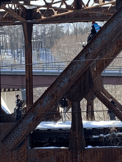 Two people were charged with resisting arrest, as well as trespassing, after climbing a railway bridge on the coal train's route through Hooksett. (Courtesy of 350 New Hampshire Action)