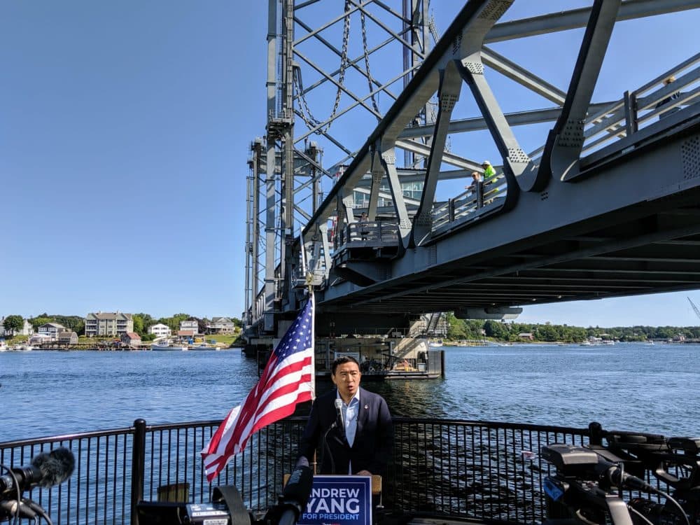 Andrew Yang announces his climate change plan on the Portsmouth, N.H. waterfront. (Annie Ropeik/NHPR)