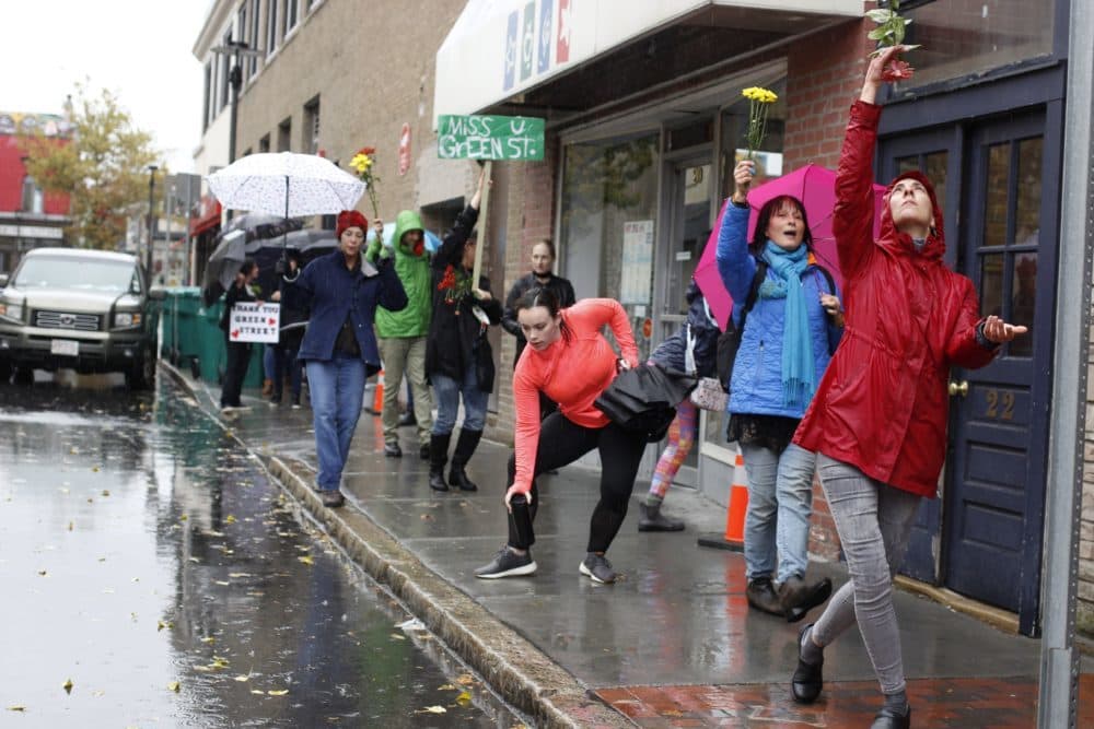 Artists and activists danced through the streets of Cambridge as Green Street Studio shuttered. (Jenn Stanley for WBUR)