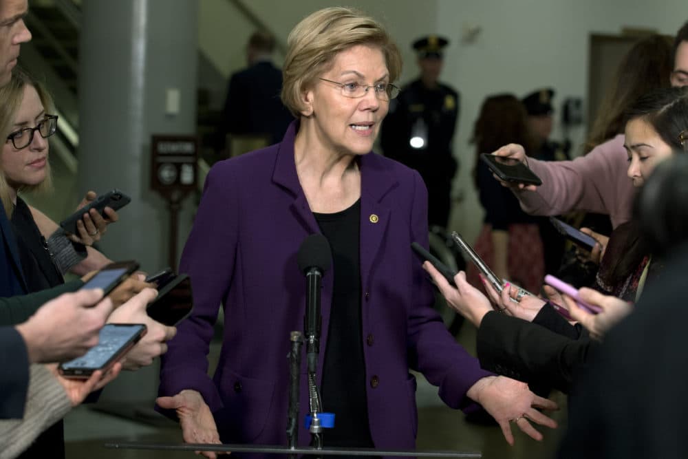 Democratic presidential candidate Sen. Elizabeth Warren, D-Mass., talks to the media as she walks to the Senate chamber on Jan. 23. (Jose Luis Magana/AP)