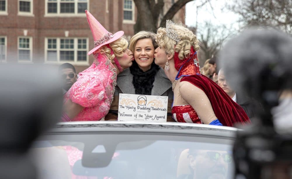 Elizabeth Banks, Hasty Pudding Theatricals’ 2020 Woman of the Year, rides through Cambridge with Hasty Pudding actors. (Robin Lubbock/WBUR)