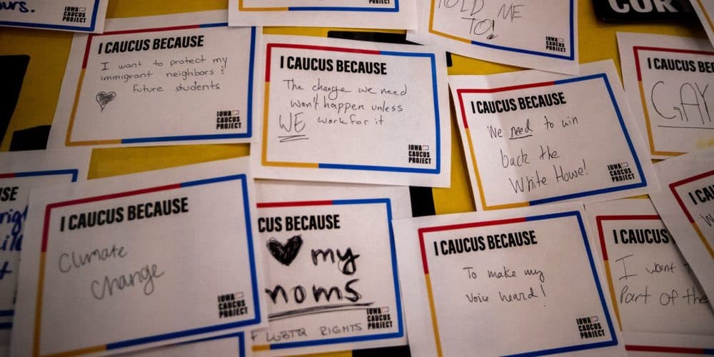 Slips of paper with responses from college students answering the question, “I caucus because …” are stuck on a wall in the student center at Drake University in Des Moines. It’s part of the Iowa Caucus Project, a program for Drake students who want to learn more about how the caucus process works. (Jesse Costa/WBUR)