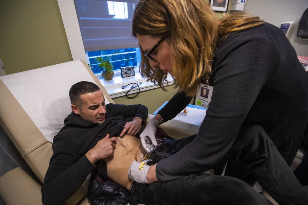 Eric receives an injection of buprenorphine from Dr. Laura Kehoe at the Center for Addiction Medicine at the Massachusetts General Hospital in Boston. (Jesse Costa/WBUR)