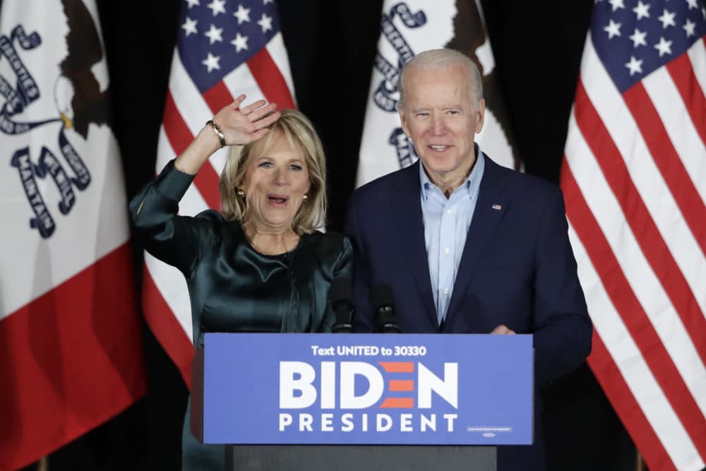 Joe Biden and Jill Biden at a caucus night campaign rally in Des Moines, Iowa. He spoke to reporters before results were announced. (Marcio Jose Sanchez/AP)