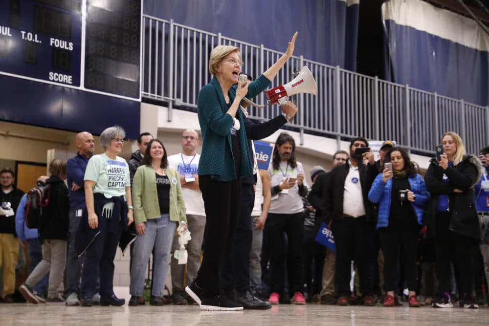 Sen. Elizabeth Warren, D-Mass., speaks at a caucus at Roosevelt High School on Monday in Des Moines, Iowa. (Andrew Harnik/AP)