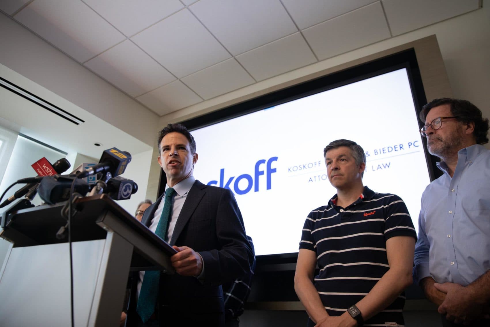 Josh Koskoff, attorney for nine families suing gun manufacturer Remington Arms Co., speaks at a 2019 press conference. Ian Hockley’s son and Bill Sherlach’s wife were killed in the 2012 Sandy Hook Elementary School Shooting. (Ryan Caron King / Connecticut Public Radio)