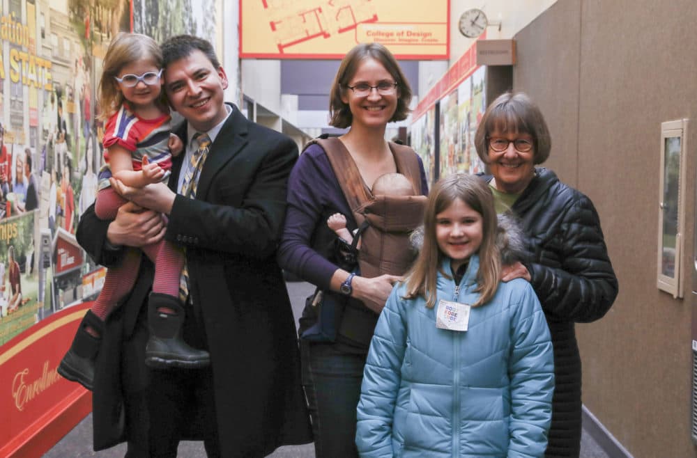 Nick and Emily Johnson of Ames, Iowa, and their kids, Norah, 4, Oliver, 9 months, and Zoe, 7, and Deborah Blaedel of Ames, Iowa. (Rebecca F. Miller for Here and Now)