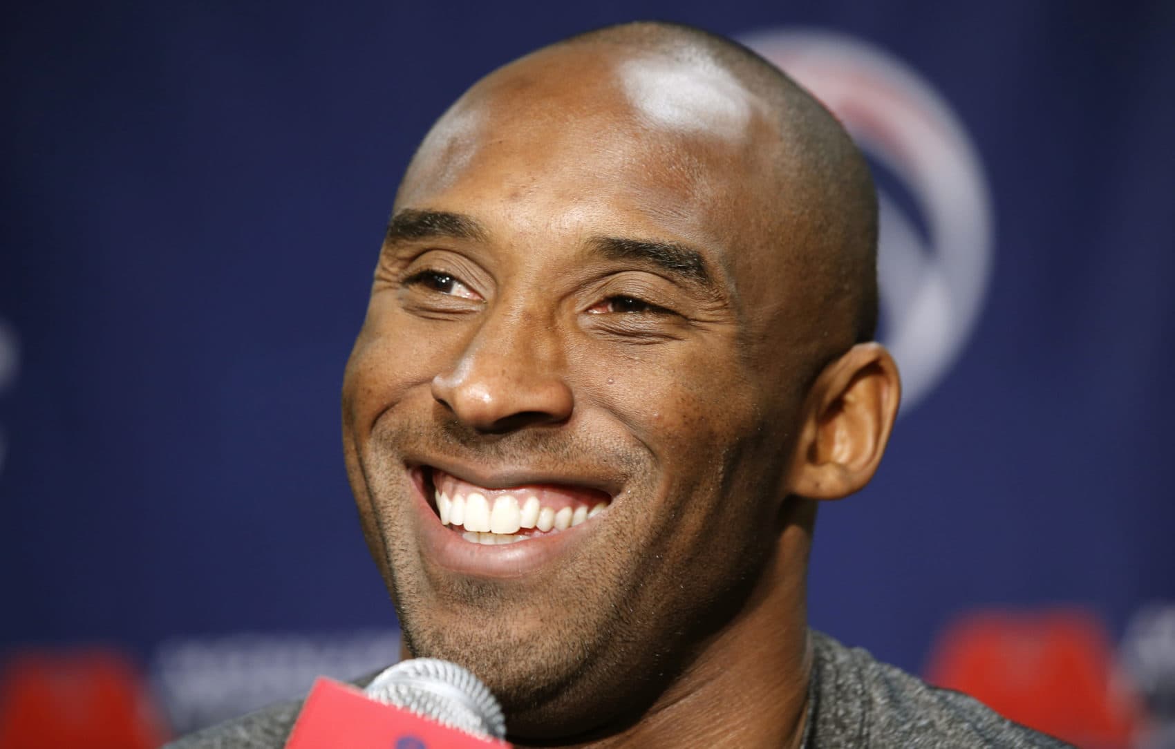 Kobe Bryant smiles during a media availability before a basketball game in 2013. (Alex Brandon/AP)