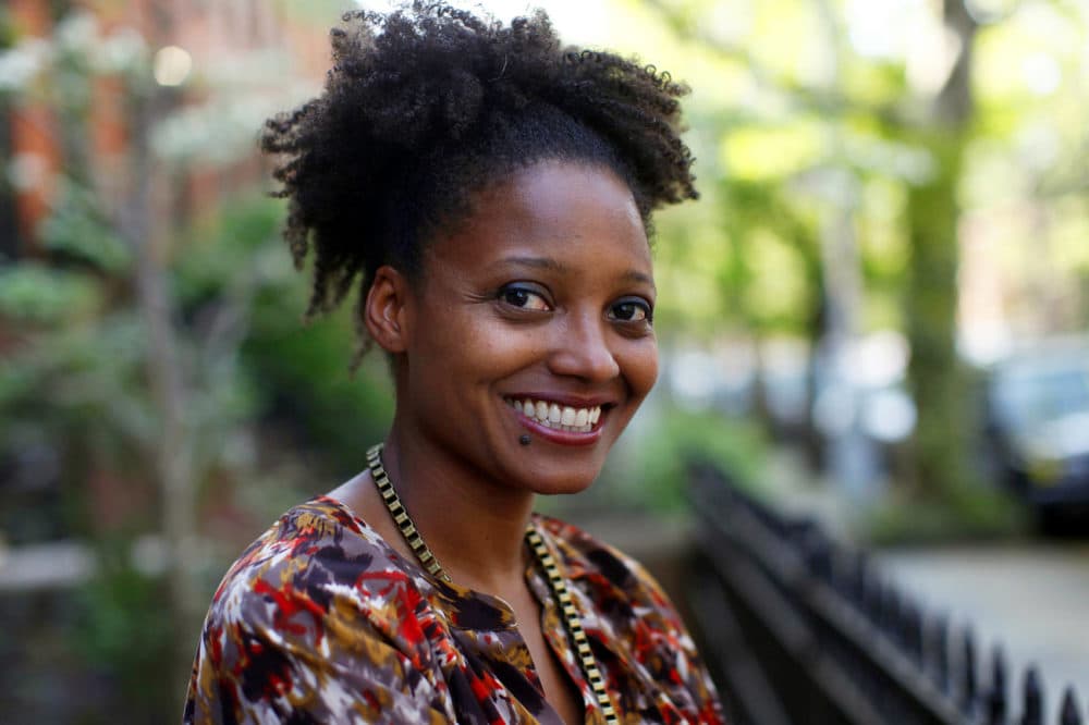 In this April 16, 2012 file photo, Pulitzer Prize winning poet Tracy K. Smith poses outside her apartment in New York. Smith has embarked on the first of several trips to bring her poetry to rural pockets of the country where she says book festivals rarely take her. (Jason DeCrow, File/AP)
