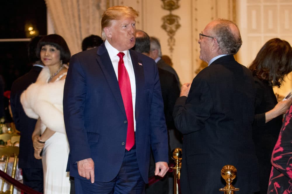 President Donald Trump speaks to attorney Alan Dershowitz, right, as he arrives for Christmas Eve dinner at Mar-a-lago in Palm Beach, Fla., Tuesday, Dec. 24, 2019. (Andrew Harnik/AP)