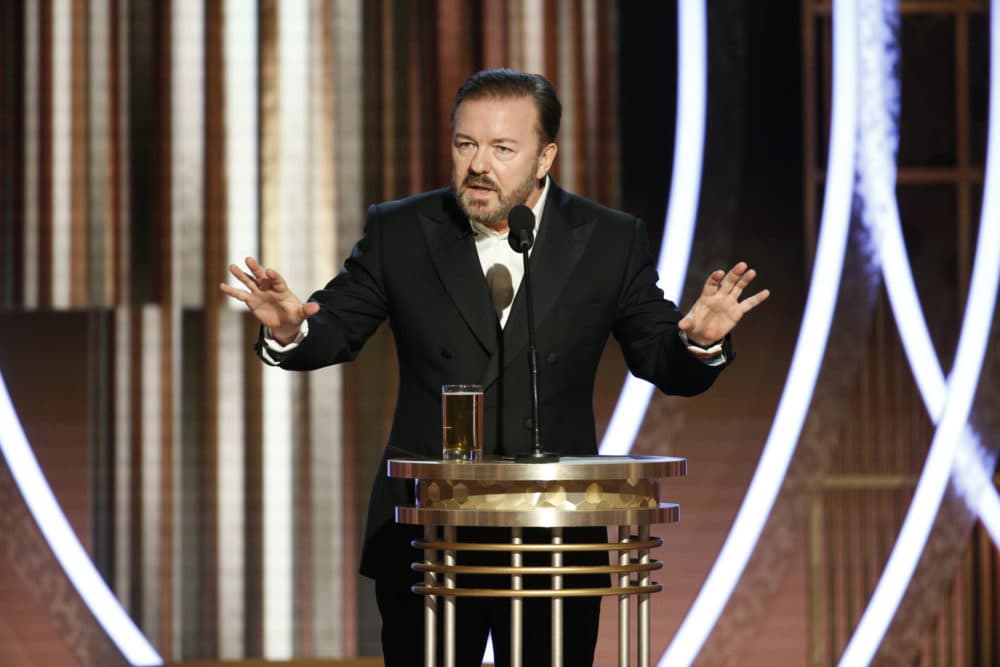 This image released by NBC shows host Ricky Gervais speaking at the 77th Annual Golden Globe Awards at the Beverly Hilton Hotel in Beverly Hills, Calif., on Sunday, Jan. 5, 2020. (Paul Drinkwater/NBC via AP)