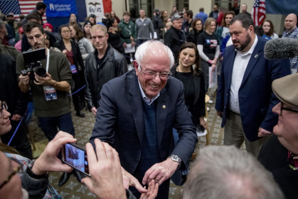Sanders greets member of the audience after speaking at a campaign stop at St. Ambrose University, Jan. 11, 2020, in Davenport, Iowa. (Andrew Harnik/AP)