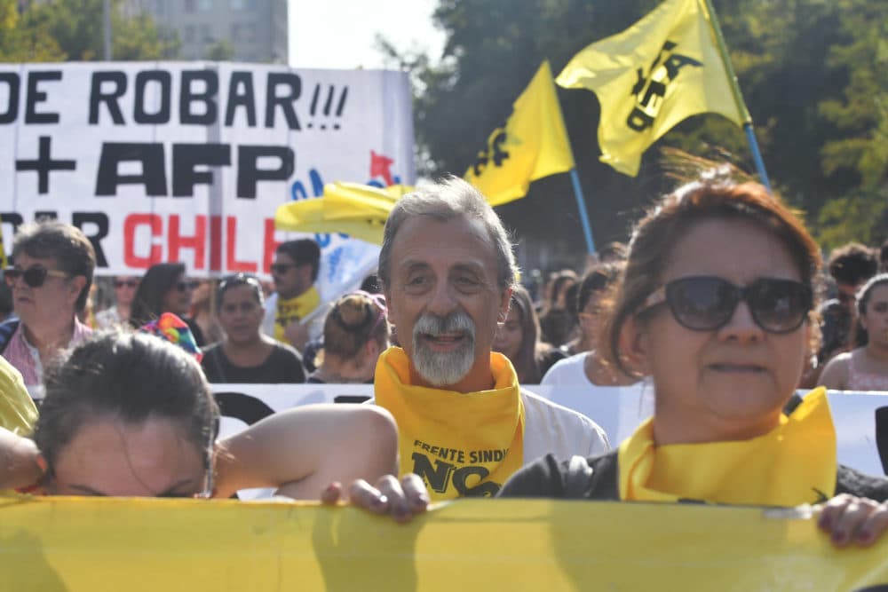 Marchers protest Chile's private pension system. (Jorge Sanchez for WBUR)