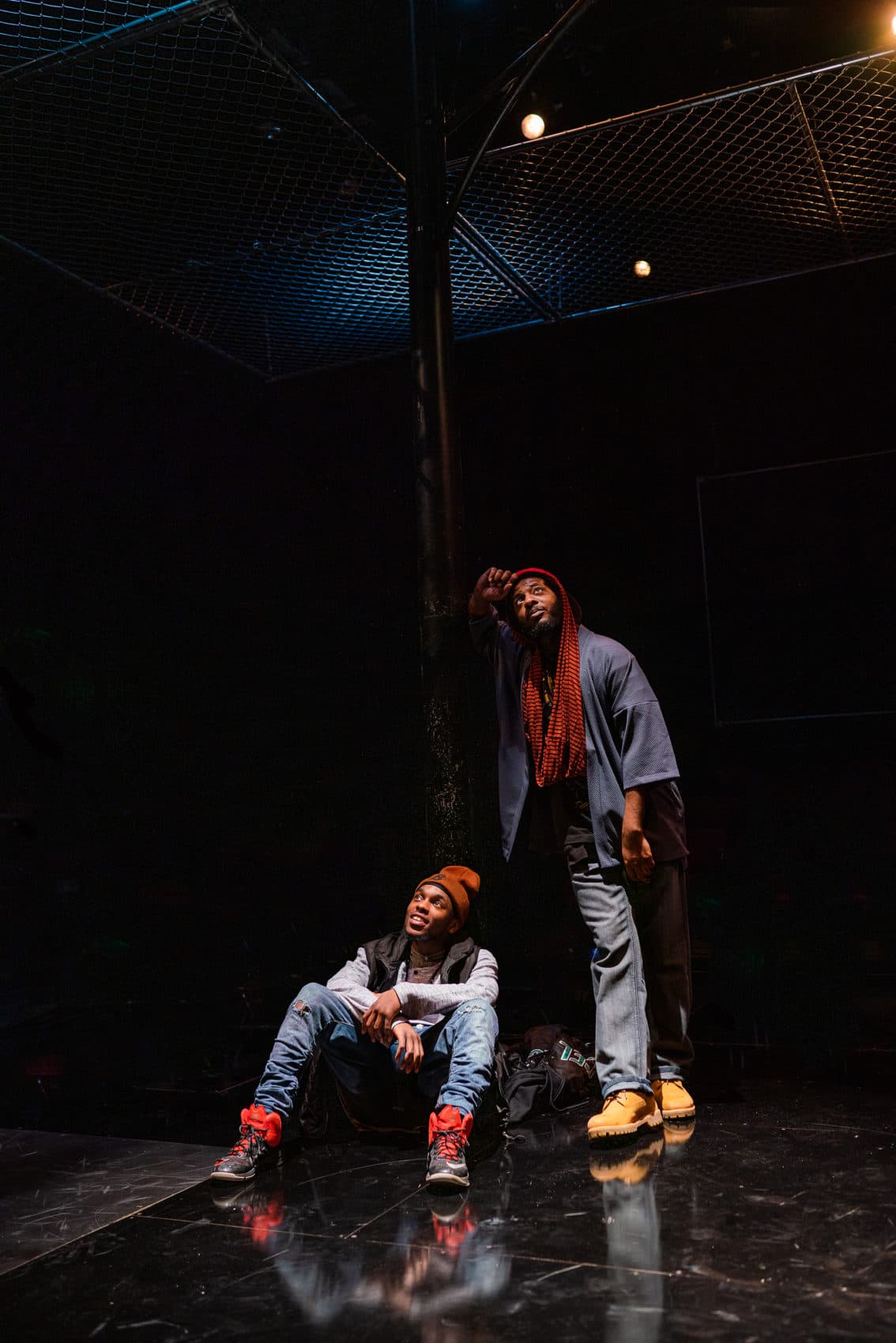 Hubens "Bobby" Cius and Kadahj Bennett in SpeakEasy Stage's production of "PASS OVER." (Courtesy Nile Scott Studios)