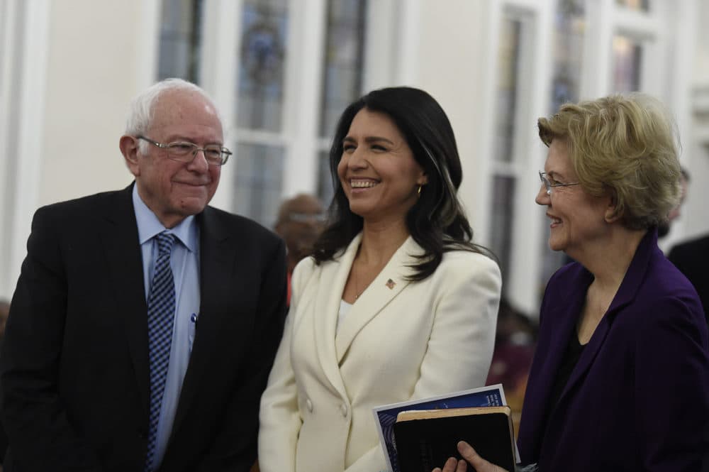 US. Sen. Bernie Sanders, left, I-Vt., U.S. Rep. Tulsi Gabbard, center, D-Hawaii, and Sen. Elizabeth Warren, right, D-Mass., speak at a Martin Luther King Jr. Day services at Zion Baptist Church on Jan. 20 in Columbia, S.C. (Meg Kinnard/AP)