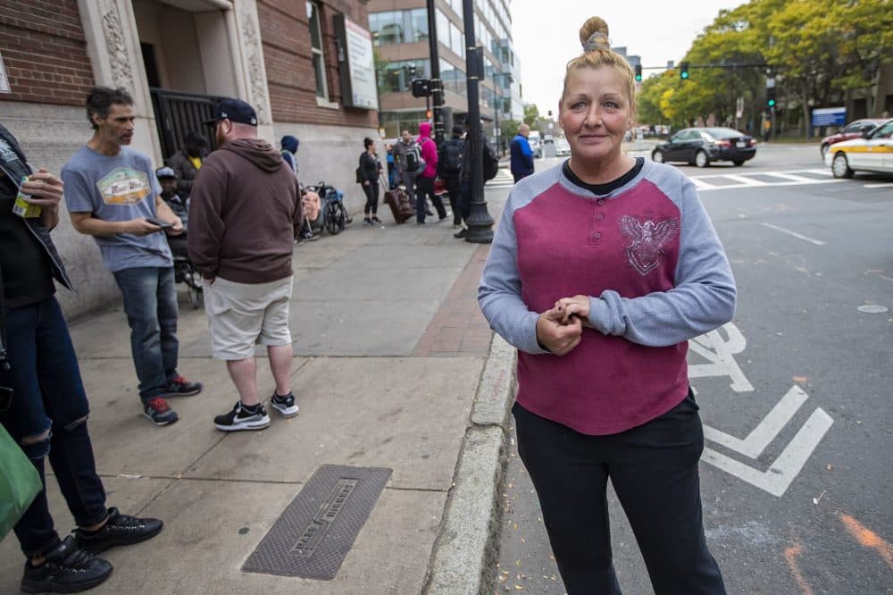 Janine Day stands outside Boston Health Care for the Homeless Program, where she receives methadone treatment. (Jesse Costa/WBUR)