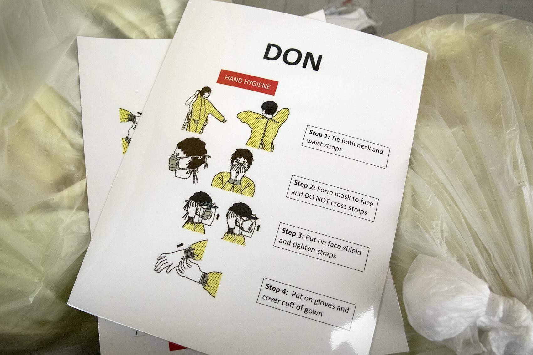 An instruction card used in protective equipment training sessions at Tufts Medical Center. (Robin Lubbock/WBUR)
