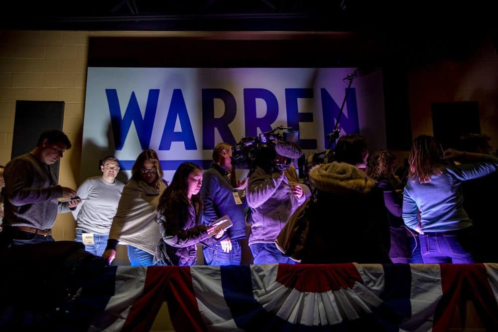 The news media lines up for an interview with Warren. (Jesse Costa/WBUR)