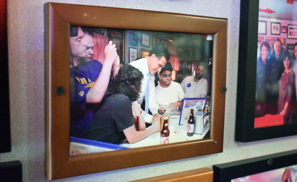 A photo of Mitt Romney hangs on the wall of the Red Arrow Diner in Manchester, New Hampshire. The diner is a frequent stop for politicians, especially presidential candidates. (Meghan B. Kelly/WBUR)