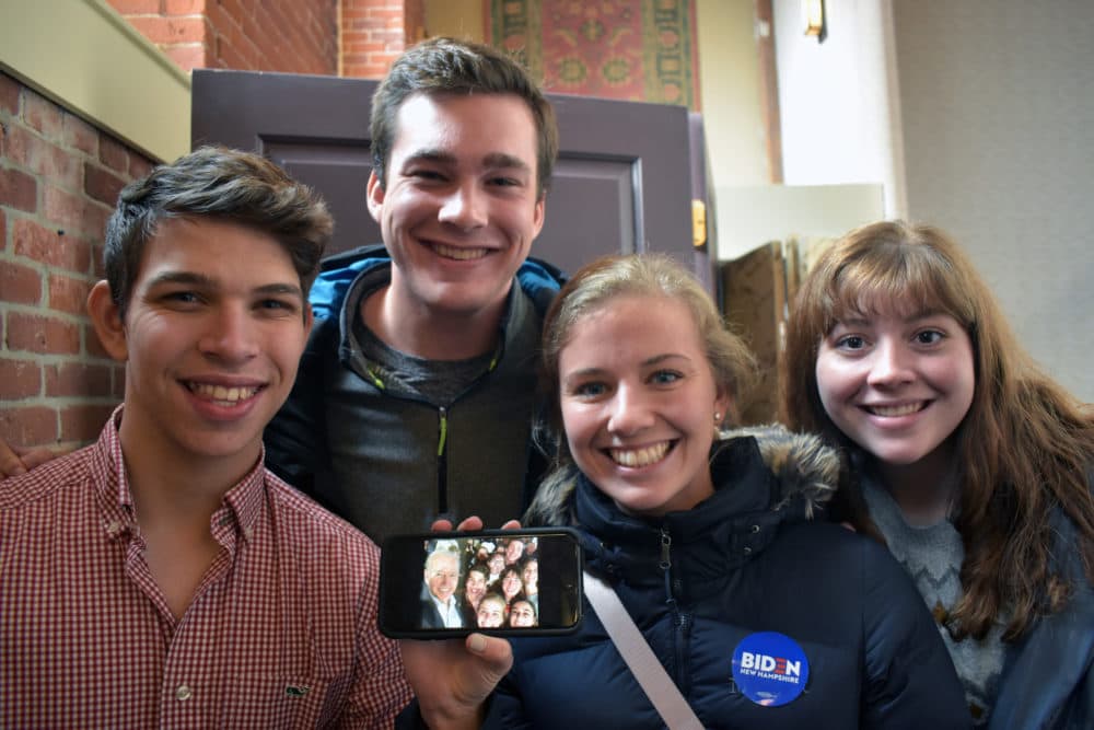 A group of students from Principia College in Elsah, Illinois, show the selfie they took with Joe Biden. The students are part of a special program called Race for the White House where they travel to campaign stops and rallies in Iowa and New Hampshire (among other places) to learn about the process. From left is Hunter Hummell, Will Adler, Chrissy Fredrikson and Sarah Geis. (Meghan B. Kelly/WBUR)