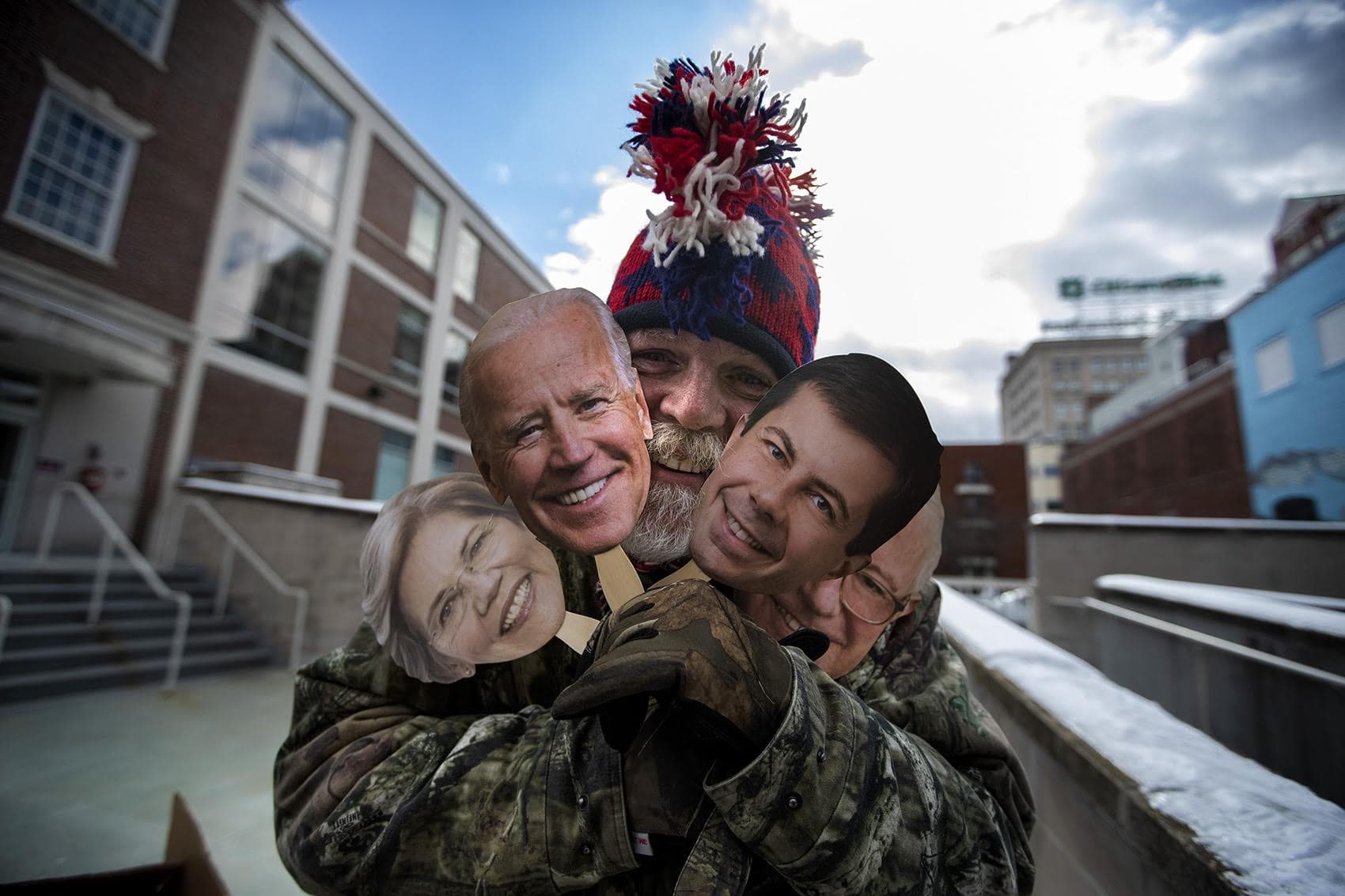 Mike Kruneir was selling the “Faces of the Democratic Party” outside the Rex Theater before a Joe Biden rally, Saturday, Feb. 8, 2020. (Jesse Costa/WBUR)