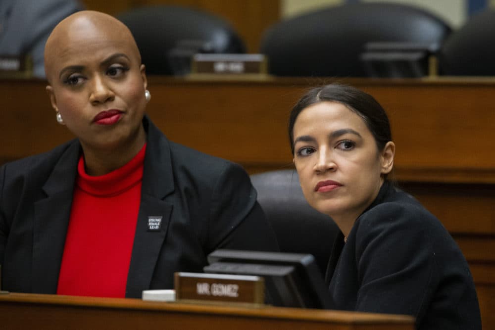 Rep. Ayanna Pressley, D-Mass., left, and Rep. Alexandria Ocasio-Cortez, D-N.Y., listen as U.S. Census Bureau Director Steven Dillingham testifies during a hearing of the House Committee on Oversight and Reform on Capitol Hill Wednesday in Washington. (Alex Brandon/AP)