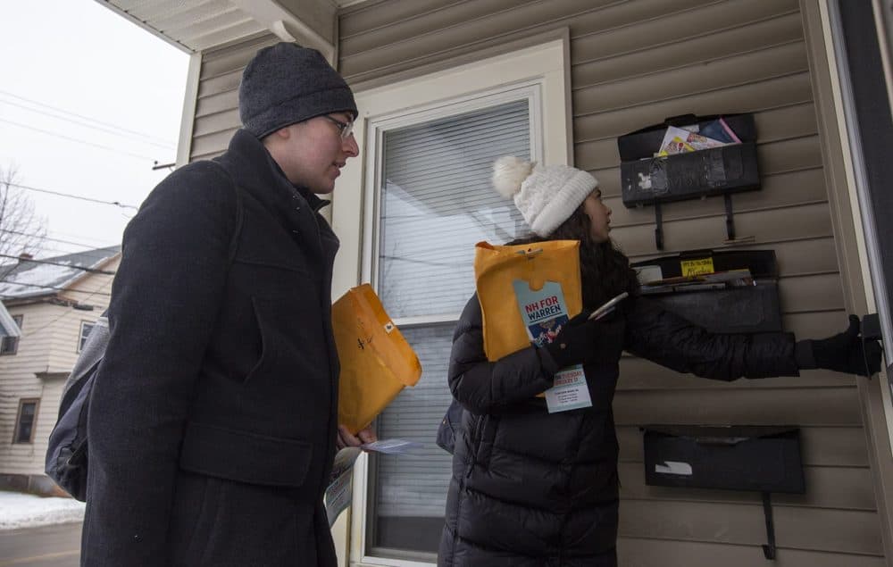 Bruce Kent-Susswein, left, of Huntington, N.Y., and Lily Ibanez, of Austin, Texas, are two Northeastern University students doing last-minute canvassing in Concord for presidential candidate U.S. Sen. Elizabeth Warren of Massachusetts. (Joe Difazio for WBUR)