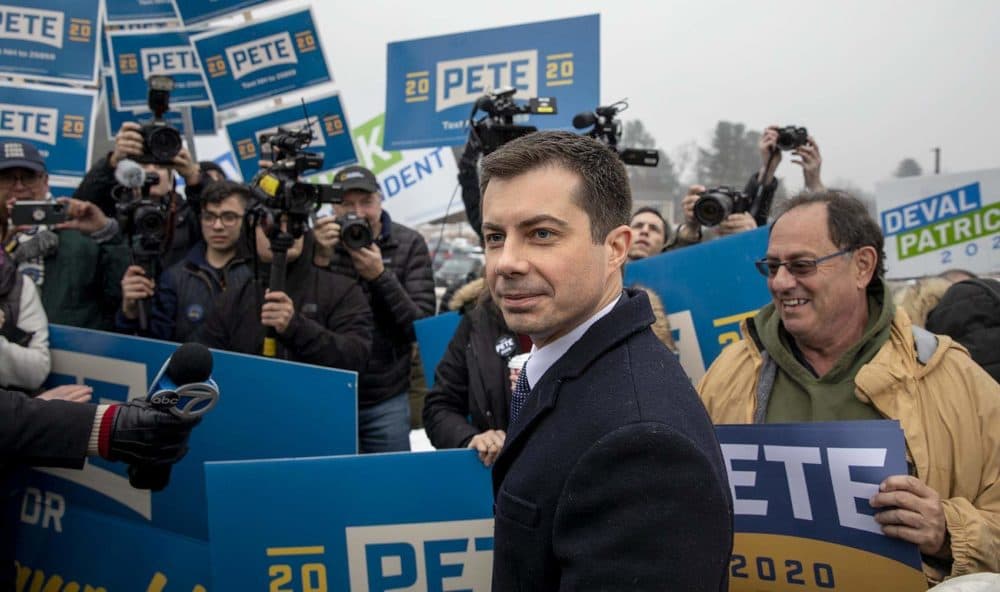 Pete Buttigieg meets campaign volunteers outside a polling station in Nashua, N.H. (Robin Lubbock/WBUR)