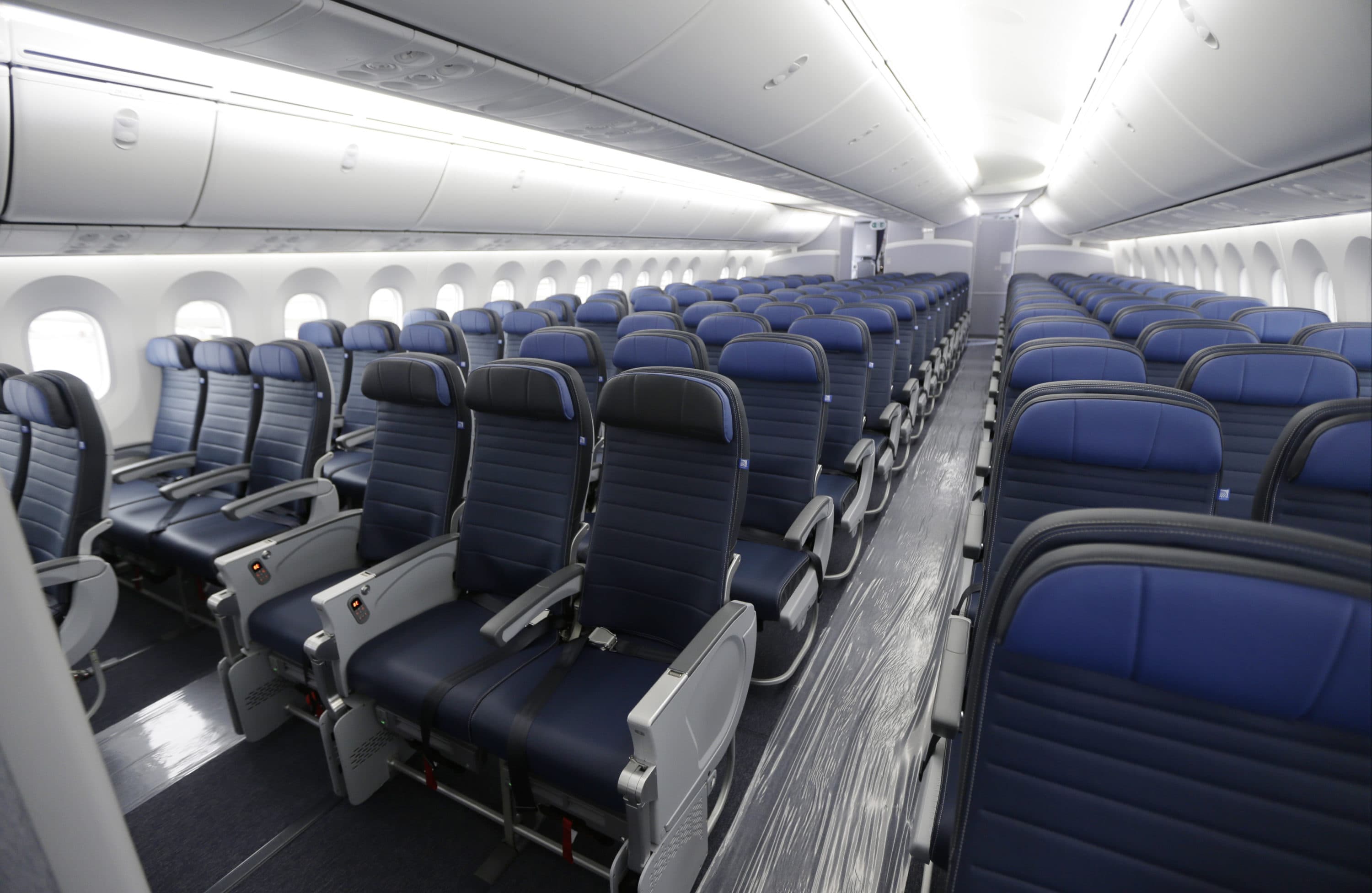 In some cases, passengers are being told they can't sit next to their children over 2 years old. (Ted S. Warren/AP)