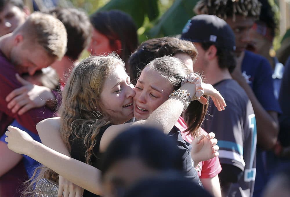 In this Thursday, Feb. 15, 2018, students gather at an event at Pine Trails Park for the victims of the Wednesday shooting at Marjory Stoneman Douglas High School, in Parkland, Fla. (Brynn Anderson/AP)