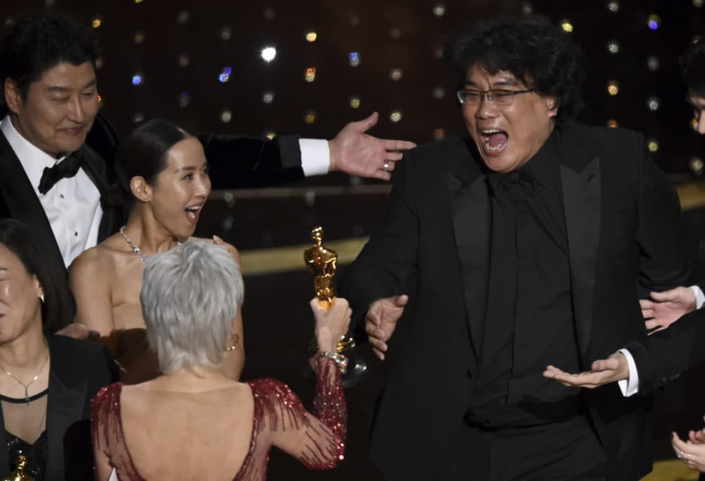 Bong Joon Ho, right, reacts as he is presented with the award for best picture for &quot;Parasite&quot; at the Oscars on Sunday. (AP/Chris Pizzello)