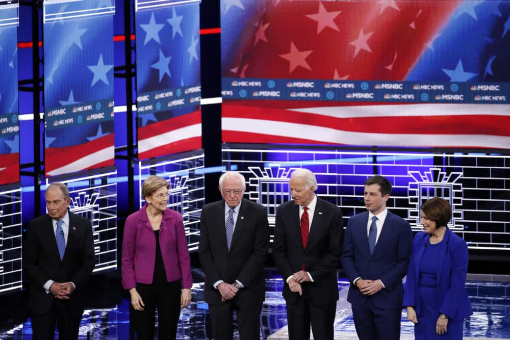 From left, Democratic presidential candidates, Michael Bloomberg, Elizabeth Warren, Bernie Sanders, Joe Biden, Pete Buttigieg and Amy Klobuchar stand on stage before a Democratic presidential primary debate Wednesday, Feb. 19, 2020, in Las Vegas, hosted by NBC News and MSNBC. (John Locher/AP)