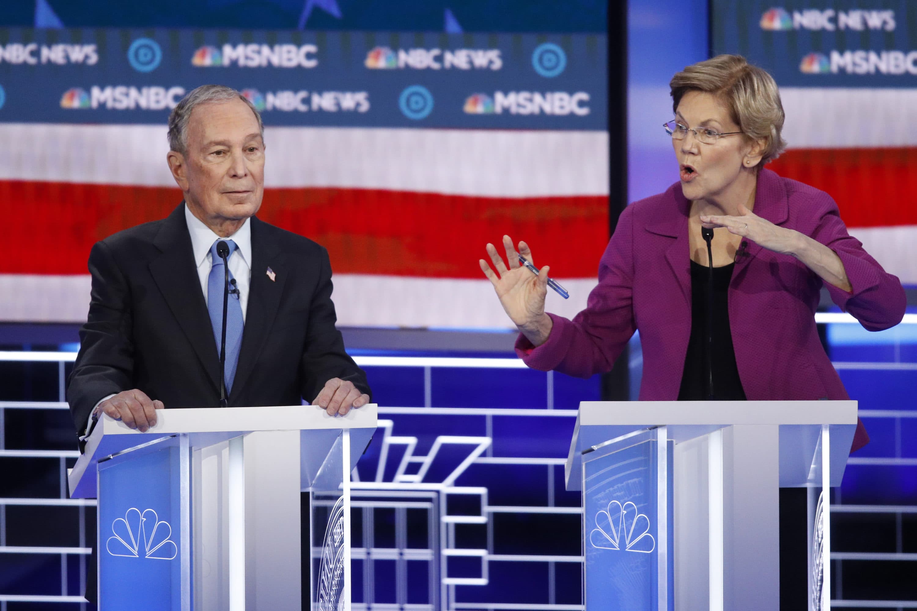 Democratic presidential candidates, former New York City Mayor Mike Bloomberg, left, listens as Sen. Elizabeth Warren, D-Mass., speak during a Democratic presidential primary debate Wednesday, Feb. 19, 2020, in Las Vegas. (John Locher/AP)