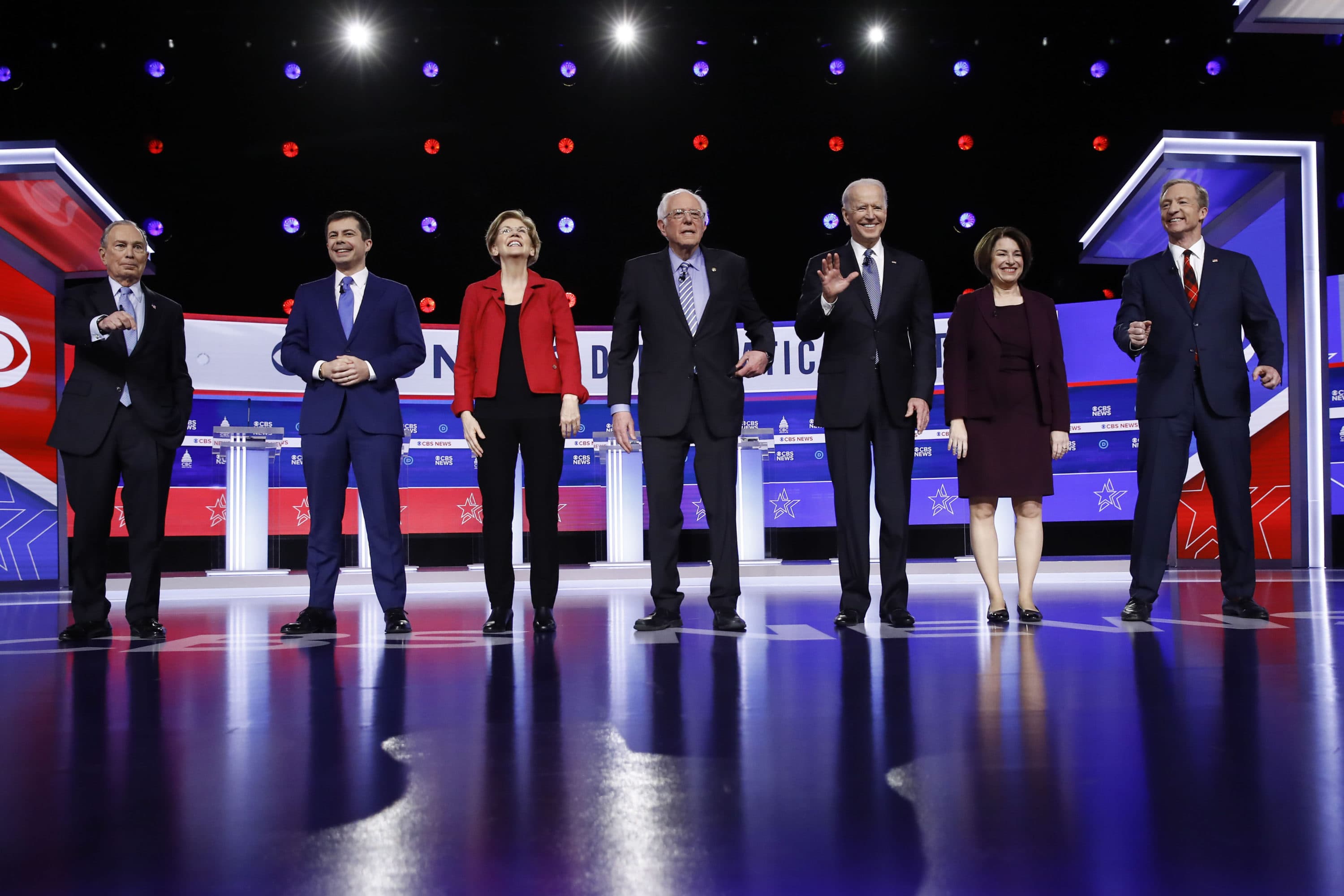 From left, Democratic presidential candidates, former New York City Mayor Mike Bloomberg, former South Bend Mayor Pete Buttigieg, Sen. Elizabeth Warren, D-Mass., Sen. Bernie Sanders, I-Vt., former Vice President Joe Biden, Sen. Amy Klobuchar, D-Minn., and businessman Tom Steyer stand on stage before a Democratic presidential primary debate, Tuesday, Feb. 25, 2020, in Charleston, S.C. (Matt Rourke/AP)