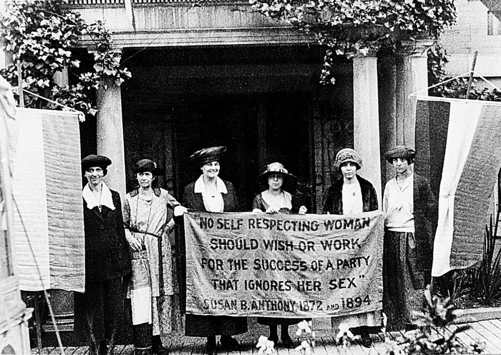Chairwoman Alice Paul, second from left, and officers of the National Woman's Party hold a banner with a Susan B. Anthony quote in front of the NWP headquarters in Washington, D.C., June 1920.  The suffragettes are ready for the G.O.P. convention to seek support for the ratification of the 19th Amendment granting women the right to vote.  (AP Photo)