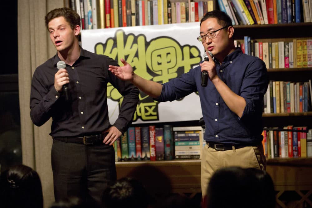 American Jesse Appell (left) is a former Fulbright Scholar who studied comedy in China as a disciple of Chinese Xiangsheng master Ding Guangquan. (Mark Schiefelbein/AP)