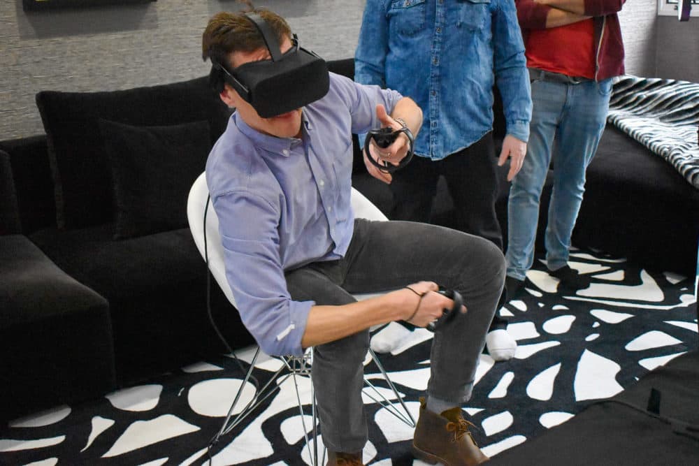 Here &amp; Now's Peter O'Dowd taking his first swing at virtual reality with the new &quot;Orion13&quot; game. (Allison Hagan/Here &amp; Now)