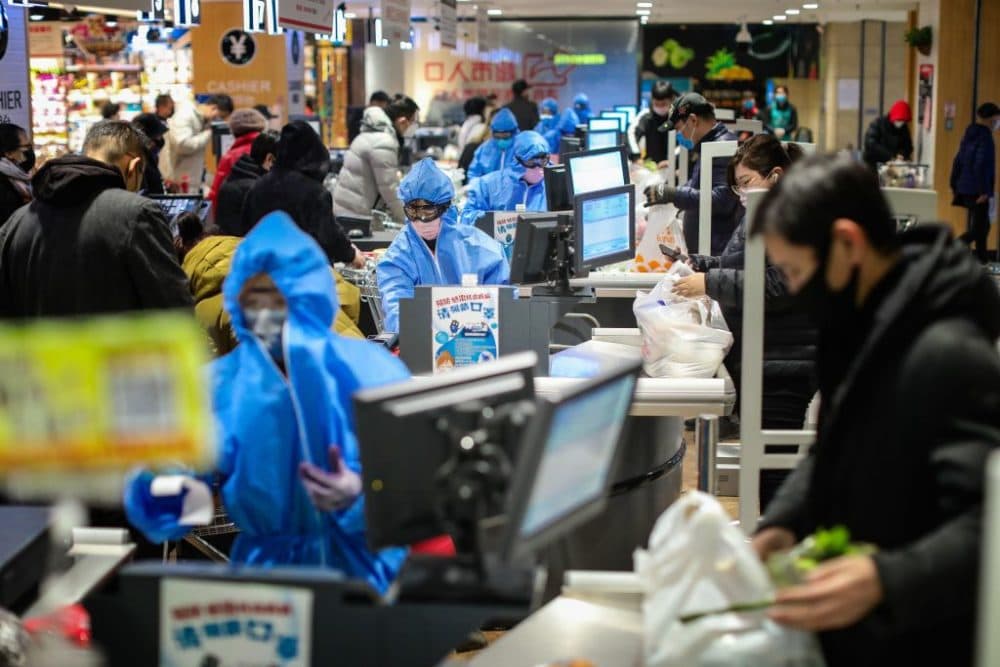 People wearing protective masks shopping at a super market in Shenyang in China's northeastern Liaoning province. (AFP via Getty)