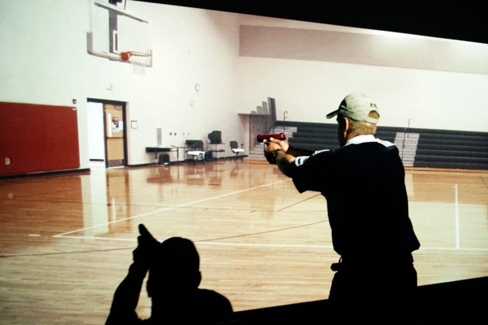A trainee takes part in a simulated active shooter drill during a three day firearms course for school teachers and administrators. (Jason Connolly/AFP/Getty Images)