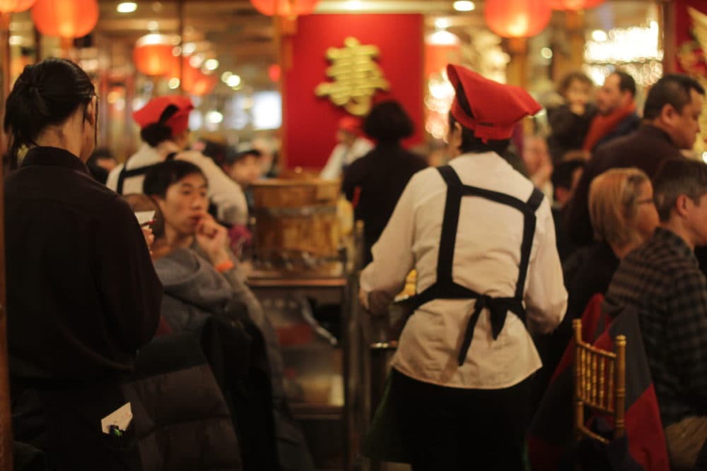 The China Pearl restaurant in Boston's Chinatown was packed with nearly 400 people having a "dim sum brunch" on Saturday in an effort to allay fears about the coronavirus. (Quincy Walters/WBUR)