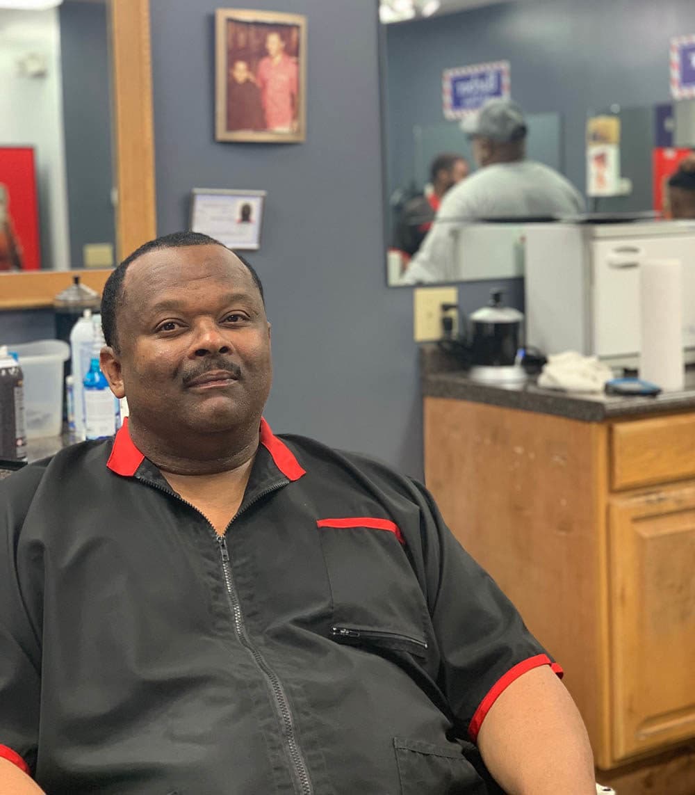 Christopher Toliver in his barber shop. (Tonya Mosley/Here &amp; Now)