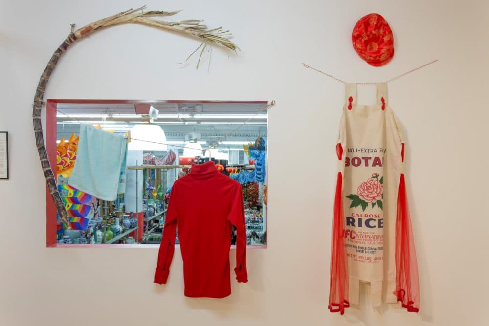 Objects from the Homeward Bound exhibition, including a rice sack outfit (right) made by Dorothy C.G. Quock of San Francisco’s Chinatown, honoring her father who delivered sacks of rice to customers during the 1930s Great Depression Image credit: Joann Lee