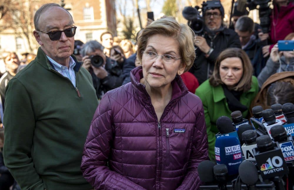 Sen. Elizabeth Warren talks to the press after announcing that she was dropping out of the Democratic presidential race. (Robin Lubbock/WBUR)