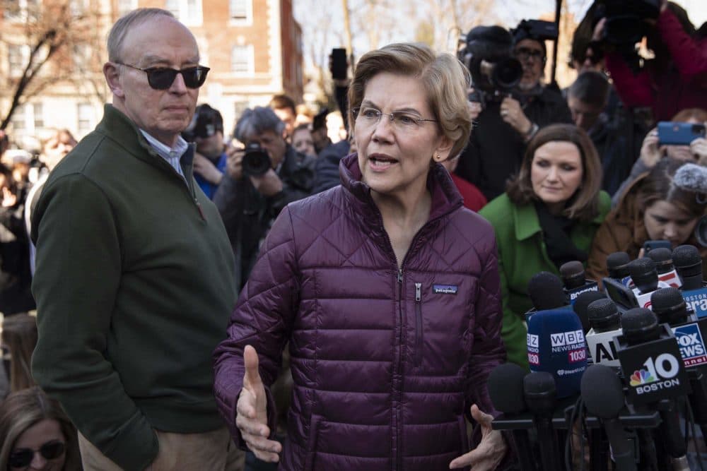 Sen. Elizabeth Warren talks to the press after announcing that she was dropping out of the Democratic presidential race. (Robin Lubbock/WBUR)