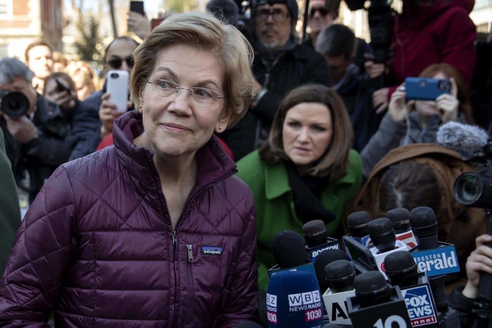 Sen. Elizabeth Warren talks to the press after announcing that she was dropping out of the Democratic presidential race. (Robin Lubbock/WBUR)