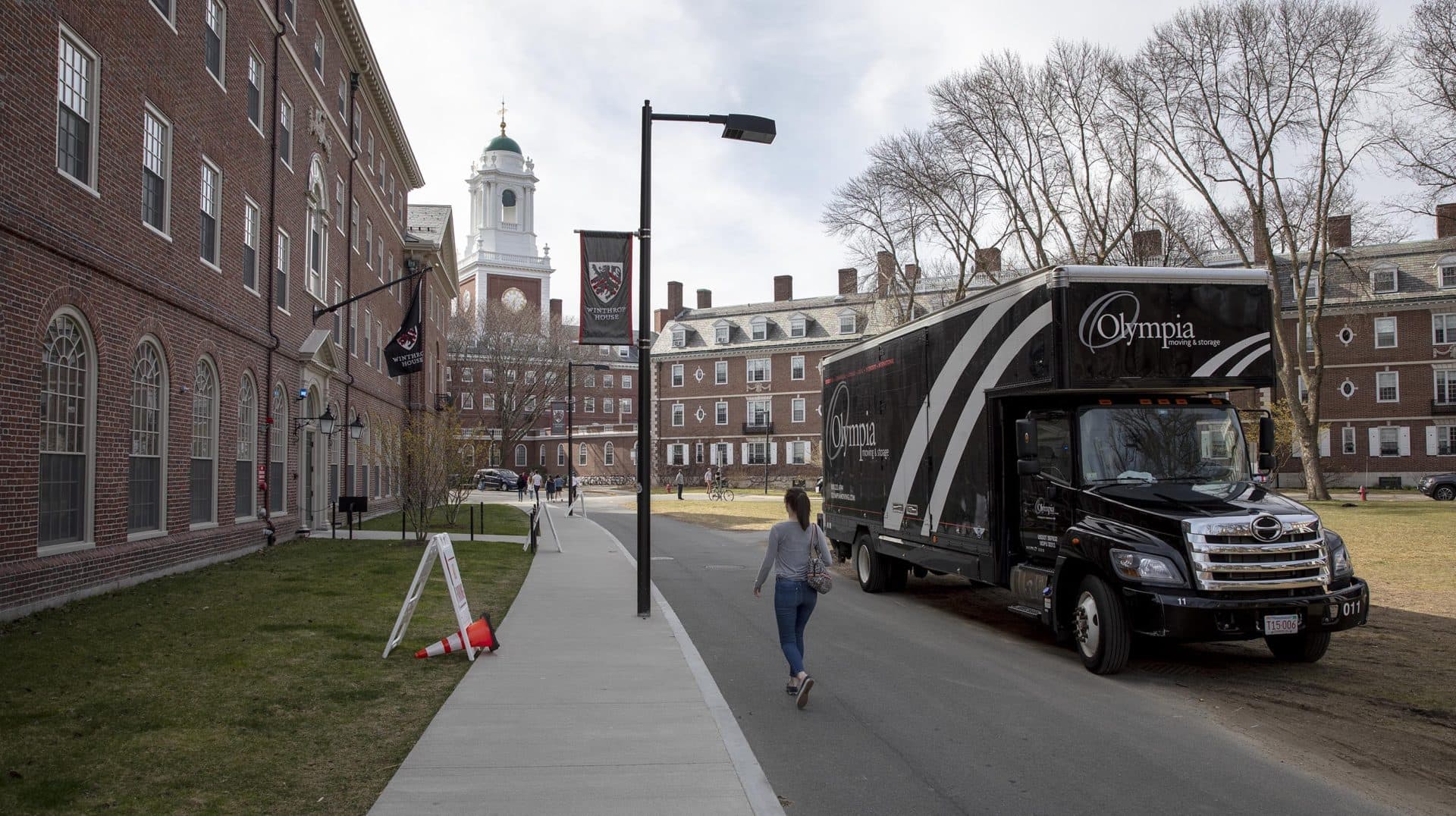 March 11: A moving vehicle waits near Harvard’s Winthrop House as the university prepares for student departures due to the coronavirus. (Robin Lubbock/WBUR)
