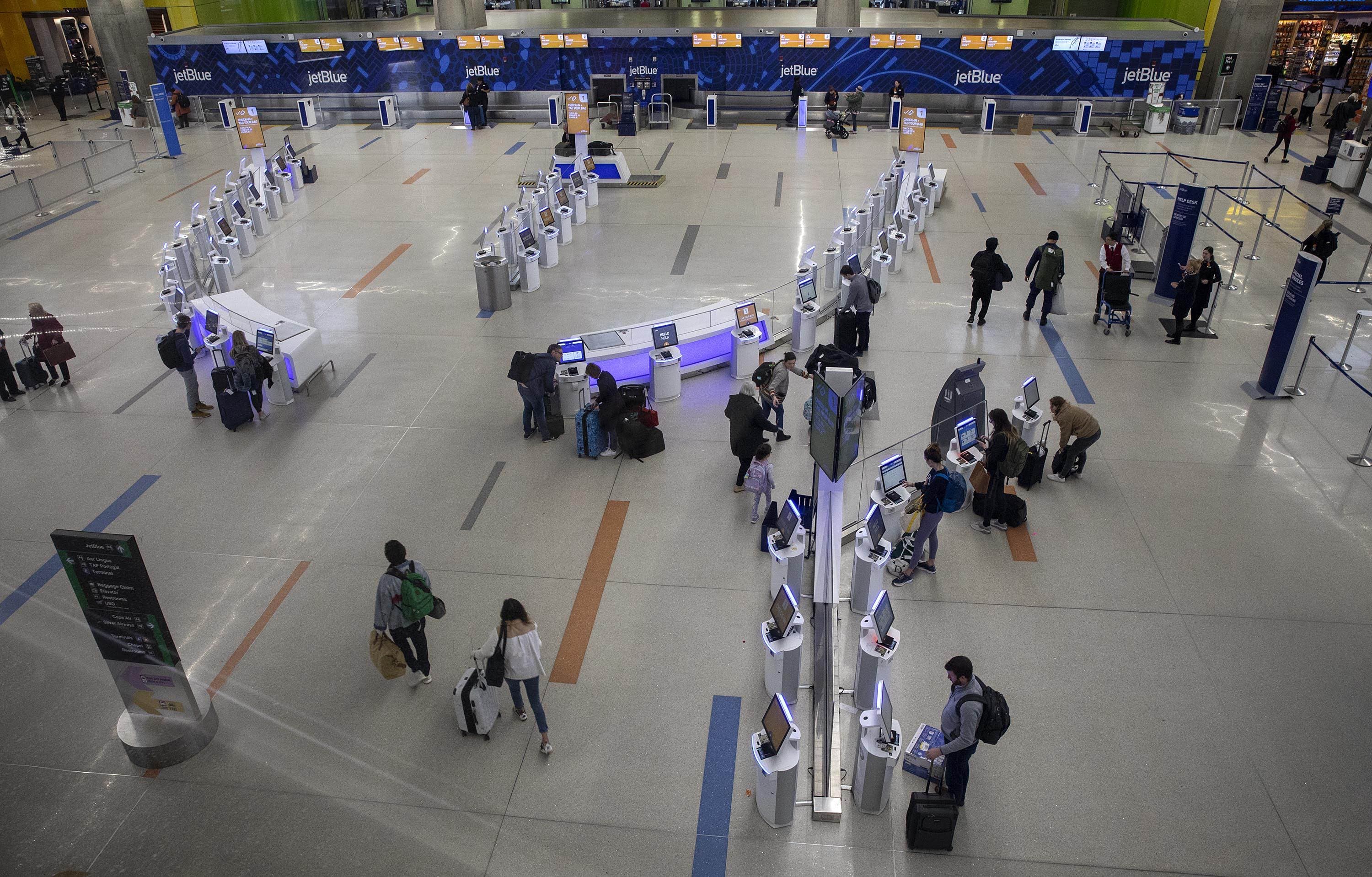Light passenger traffic through the jetBlue check-in area at Logan Airport. (Robin Lubbock/WBUR)