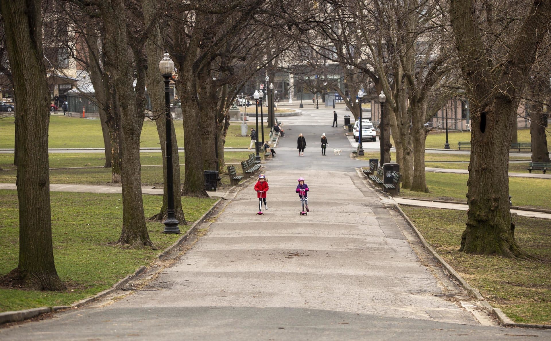 March 17: A family out for a walk on Boston Common finds plenty of space for scooter riding. (Robin Lubbock/WBUR)