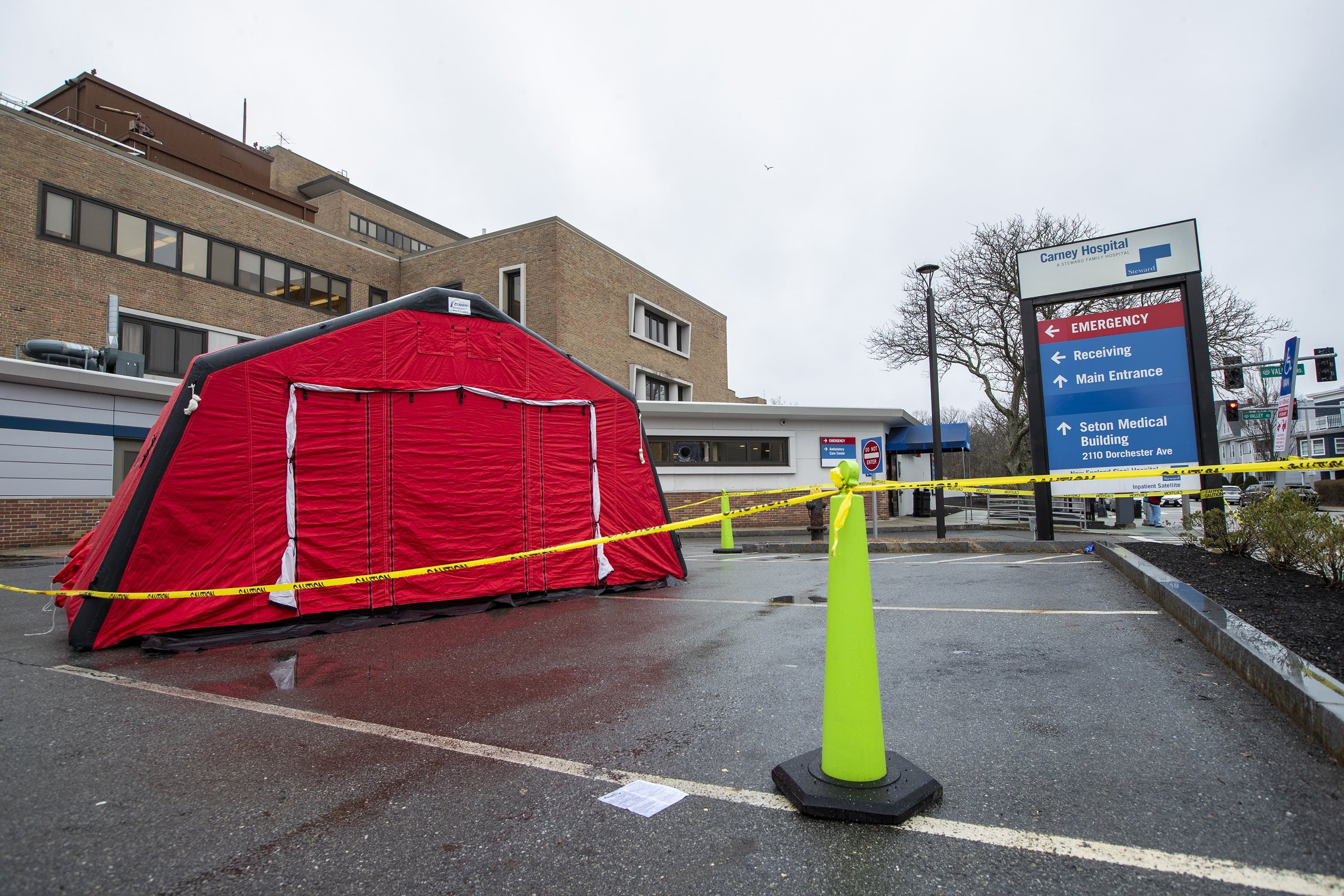 Carney Hospital in Dorchester will be transformed into the nation’s first “Dedicated Care Center” for treating patients who test positive for COVID-19. A tent was erected outside Carney's emergency department that will be used to test patients directed by their physicians to be tested for COVID-19. (Jesse Costa/WBUR)